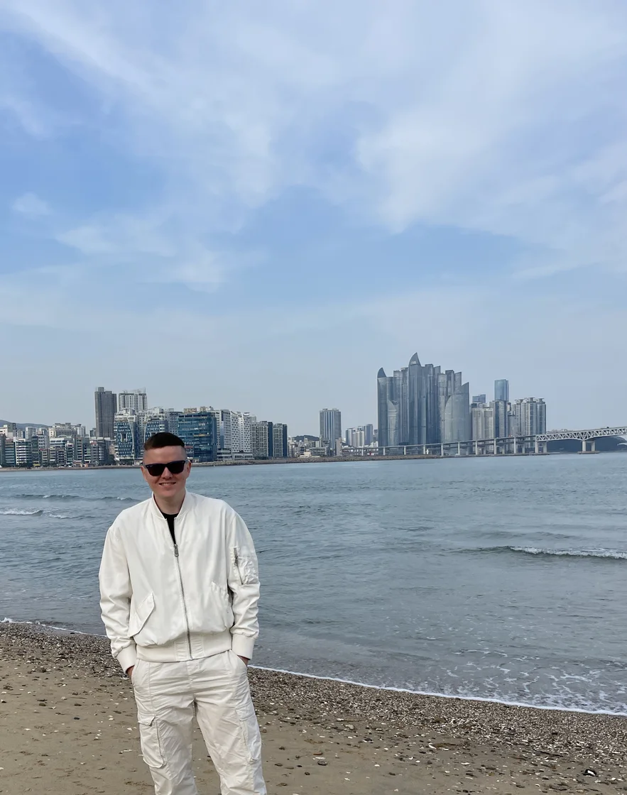 Oleg Polakow standing by the sea